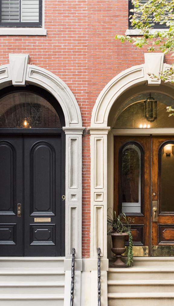 Two iconic brick house doorways in the style of Boston's Beacon Hill Federal houses and the row houses from Boston's south end 