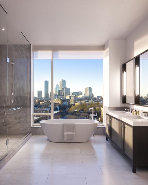 The Quinn penthouse bathroom and soaking tub with a breathtaking view of the city of Boston